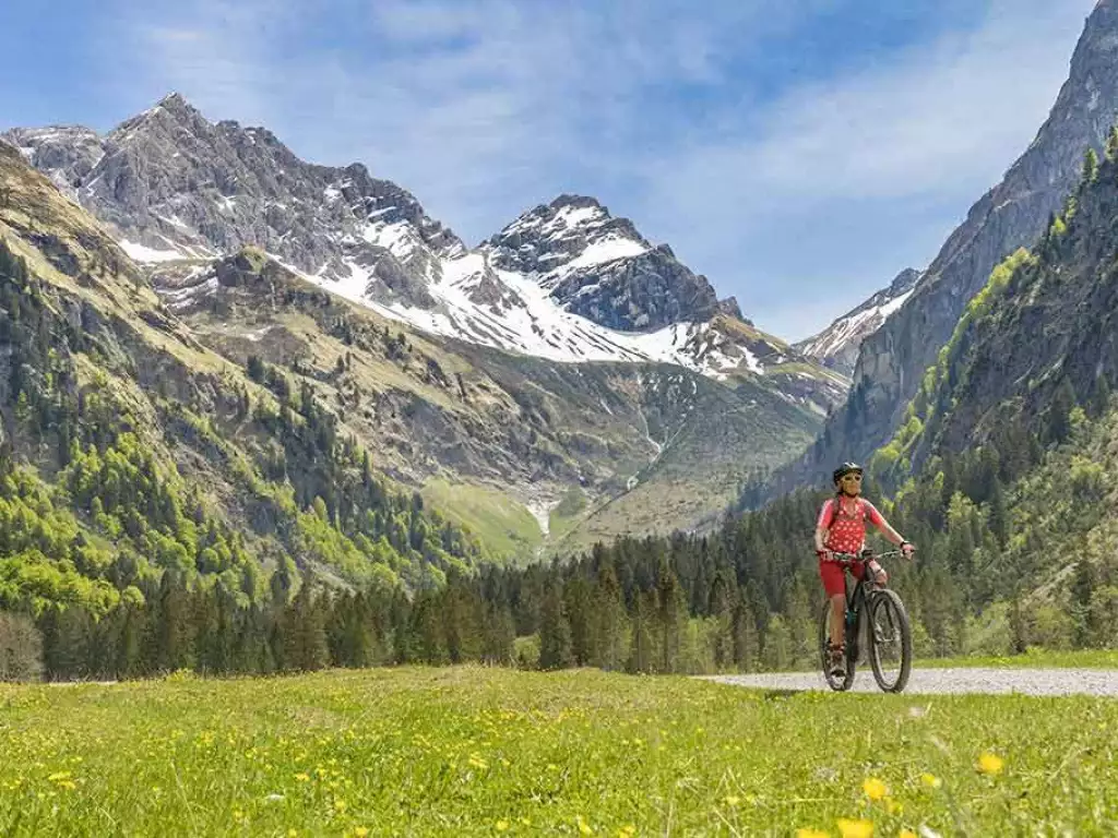 Cyclist with mountains in the background